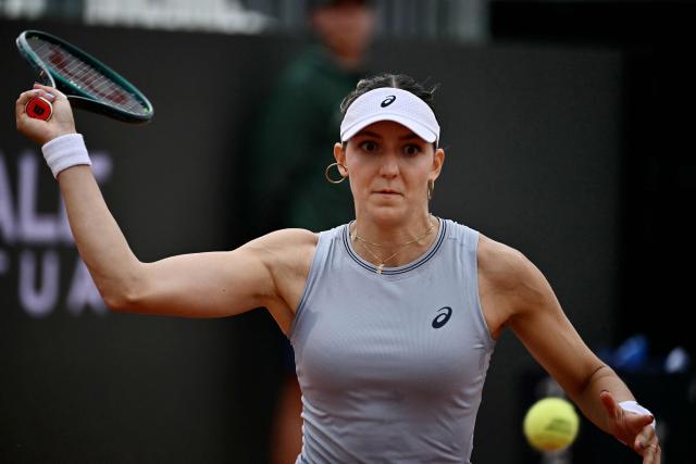 Switzerland's Rebeka Masarova hits a return to USA's Jessica Pegula during their women's singles match at the WTA Rome Open tennis tournament at Foro Italico in Rome on May 10, 2026. (Photo by Filippo MONTEFORTE / AFP)