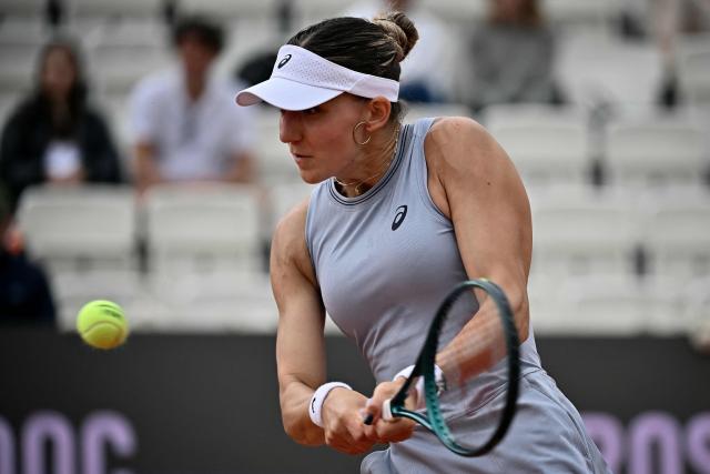 Switzerland's Rebeka Masarova hits a return to USA's Jessica Pegula during their women's singles match at the WTA Rome Open tennis tournament at Foro Italico in Rome on May 10, 2026. (Photo by Filippo MONTEFORTE / AFP)