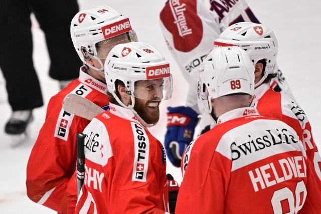 Switzerland's Christoph Bertschy (88, 2nd L) celebrates scoring during the ice hockey Euro Hockey Tour (EHT) Beijer Hockey Games match between Switzerland and Czechia at Catena Arena in Angelholm, Sweden, on May 10, 2026. (Photo by Johan Nilsson/TT / TT News Agency / AFP) / Sweden OUT