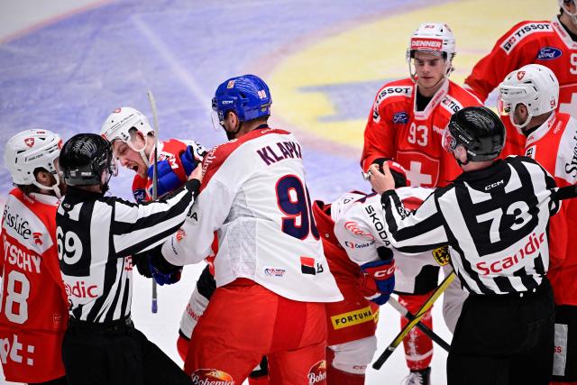 Switzerland's Dean Kukan (3rd L) and Czechia's Adam Klapka (4th L) fight during the ice hockey Euro Hockey Tour (EHT) Beijer Hockey Games match between Switzerland and Czechia at Catena Arena in Angelholm, Sweden, on May 10, 2026. (Photo by Johan Nilsson/TT / TT News Agency / AFP) / Sweden OUT