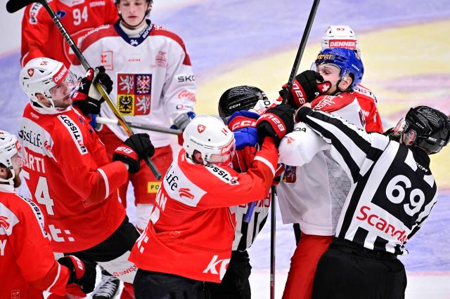 Switzerland's Dean Kukan (C-L) and Czechia's Adam Klapka (2nd R) fight during the ice hockey Euro Hockey Tour (EHT) Beijer Hockey Games match between Switzerland and Czechia at Catena Arena in Angelholm, Sweden, on May 10, 2026. (Photo by Johan Nilsson/TT / TT News Agency / AFP) / Sweden OUT