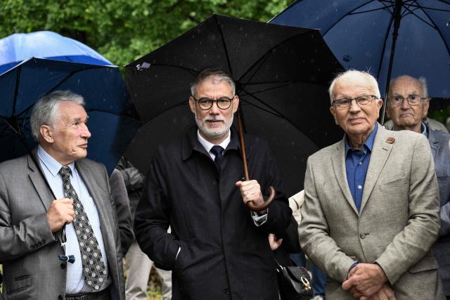 First Secretary of the French Socialist party (PS) and Socialistes et Apparentes' MP Olivier Faure (C) speaks with son of former French president François Mitterrand, Gilbert Mitterrand (L), and a close associate of François Mitterrand and one of his ministers Jean Galavany (R) at the François Mitterrand Memorial garden during the inauguration ceremony of the Cité des présents (former Musée du septennat) in Château-Chinon, central-eastern France, on May 10, 2026. After seven years of work, the new complex, renamed Cité des présent, was inaugurated on May 10, the 45th anniversary of the 1981 presidential election. The complex includes a fashion museum and a gift museum, which displays nearly 350 objects received by François Mitterrand during visits to 86 countries during his two seven-year terms (1981-1995). (Photo by ARNAUD FINISTRE / AFP)