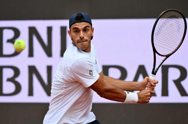 Argentina's Francisco Cerundolo hits a return to Italy's Lorenzo Musetti during their men's singles match at the ATP Rome Open tennis tournament at Foro Italico in Rome on May 10, 2026. (Photo by Alberto PIZZOLI / AFP)