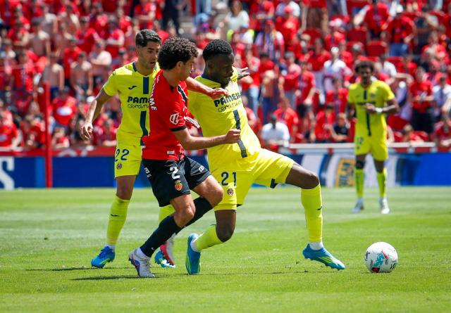 Real Mallorca’s Spanish defender #2 Mateu Jaume (L)  vies with Villarreal’s Canadian forward #21 Tani Oluwaseyi during the Spanish league football match between RCD Mallorca and Villarreal CF at Mallorca Son Moix Stadium in Palma de Mallorca on May 10, 2026. (Photo by JAIME REINA / AFP)