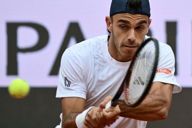 Argentina's Francisco Cerundolo hits a return to Italy's Lorenzo Musetti during their men's singles match at the ATP Rome Open tennis tournament at Foro Italico in Rome on May 10, 2026. (Photo by Alberto PIZZOLI / AFP)