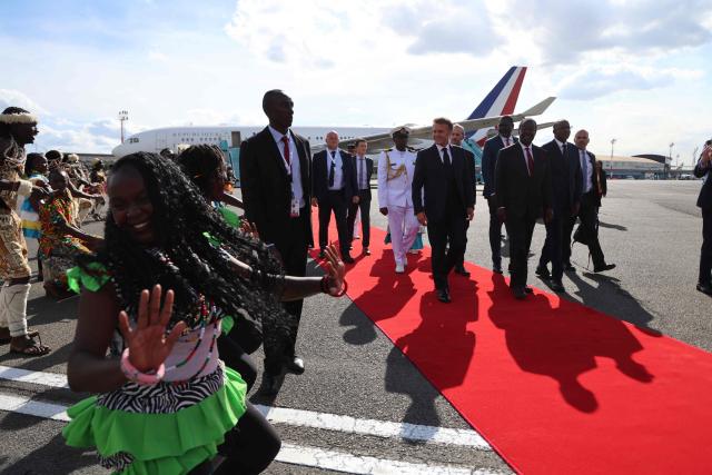 France's President Emmanuel Macron (C) watches traditional dancers perform upon his arrival ahead of the Africa Forward: Africa- France Partnerships for Innovation and Growth Summit in Nairobi, on May 10, 2026. Kenya and France will jointly host the “Africa Forward: Africa- France Partnerships for Innovation and Growth” Summit, which will bring together African and French Heads of State and Government. (Photo by Ludovic MARIN / AFP)
