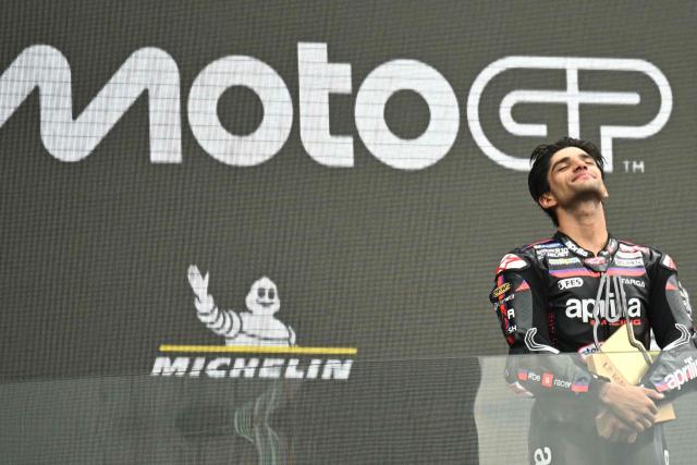 Aprilia Racing's Spanish rider Jorge Martin celebrates his victory on the podium at the end of the Moto GP Grand Prix of France at Le Mans, northwestern France, on May 10, 2026. (Photo by Loic VENANCE / AFP)