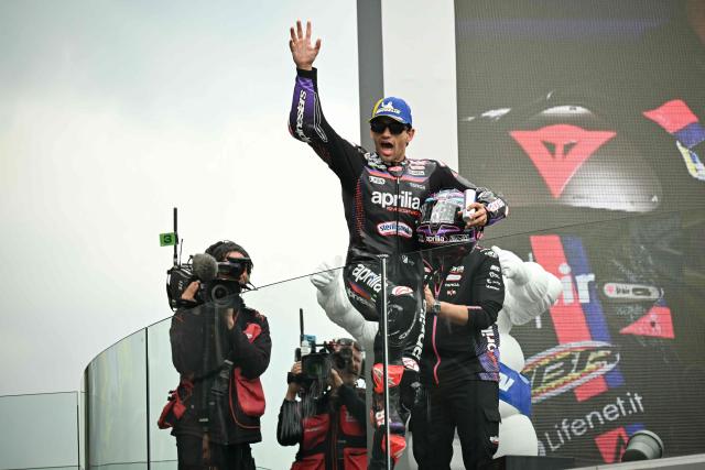 Aprilia Racing's Spanish rider Jorge Martin celebrates his victory on the podium at the end of the Moto GP Grand Prix of France at Le Mans, northwestern France, on May 10, 2026. (Photo by Loic VENANCE / AFP)