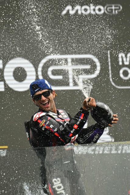 Aprilia Racing's Spanish rider Jorge Martin celebrates his victory on the podium at the end of the Moto GP Grand Prix of France at Le Mans, northwestern France, on May 10, 2026. (Photo by Loic VENANCE / AFP)