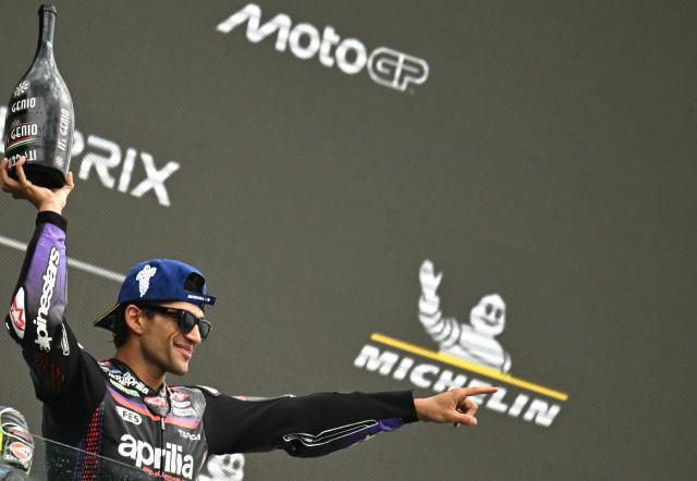 Aprilia Racing's Spanish rider Jorge Martin celebrates his victory on the podium at the end of the Moto GP Grand Prix of France at Le Mans, northwestern France, on May 10, 2026. (Photo by Loic VENANCE / AFP)
