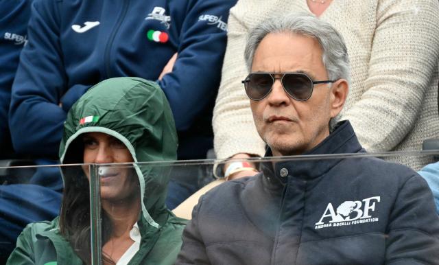 Italian singer Andrea Bocelli (R) attends the men's singles match between Argentina's Francisco Cerundolo and Italy's Lorenzo Musetti at the ATP Rome Open tennis tournament at Foro Italico in Rome on May 10, 2026. (Photo by Alberto PIZZOLI / AFP)