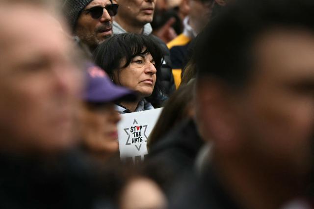 A person holds a placard during a rally organised by the Campaign Against Antisemitism, opposite Downing Street in central London on May 10, 2026. (Photo by JUSTIN TALLIS / AFP)