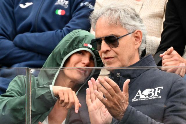 TOPSHOT - Italian singer Andrea Bocelli (R) attends the men's singles match between Argentina's Francisco Cerundolo and Italy's Lorenzo Musetti at the ATP Rome Open tennis tournament at Foro Italico in Rome on May 10, 2026. (Photo by Alberto PIZZOLI / AFP)