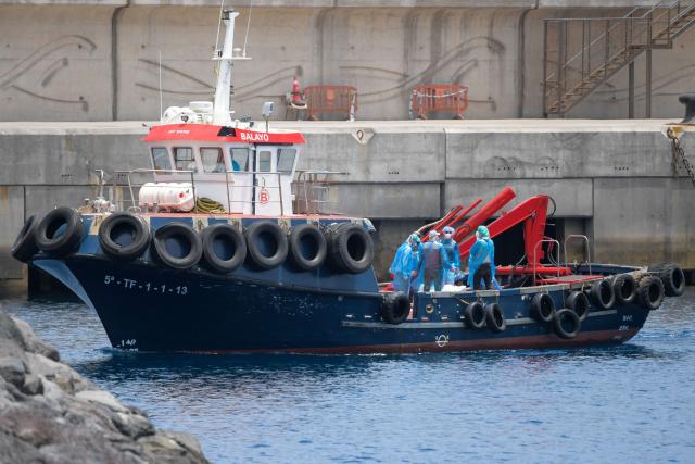 People from the Dutch flagged hantavirus-stricken cruise ship MV Hondius are transferred by boat to the industrial port of Granadilla de Abona on the island of Tenerife in Spain's Canary Islands on May 10, 2026. Repatriation flights for the nearly 150 passengers onboard the ship hit by a deadly hantavirus outbreak began as passengers were transferred to shore on smaller vessels then by bus to the airport to be flown home after weeks at sea. (Photo by JORGE GUERRERO / AFP)