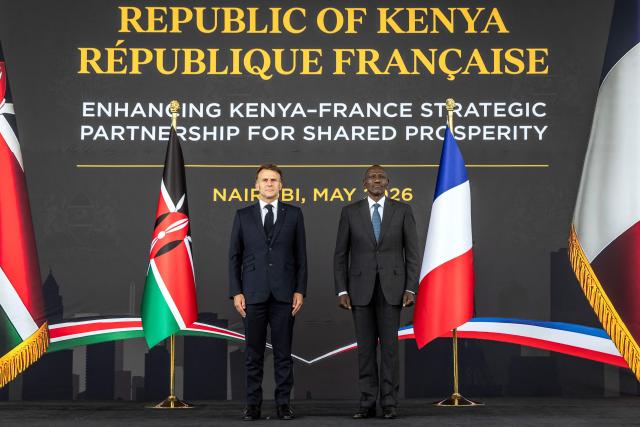 French President Emmanuel Macron (L) and Kenyan President William Ruto (R) listen to the national anthems during a reception at State House ahead of the Africa Forward: Africa- France Partnerships for Innovation and Growth Summit in Nairobi, on May 10, 2026. Kenya and France will jointly host the “Africa Forward: Africa- France Partnerships for Innovation and Growth” Summit, which will bring together African and French Heads of State and Government. (Photo by Luis TATO / AFP)