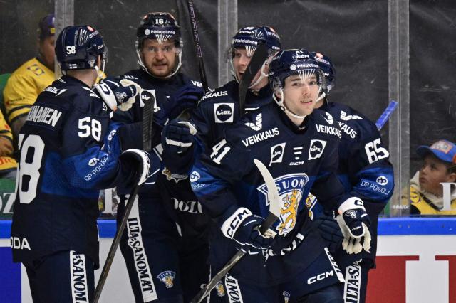 Finland's Ville Heinola (R, 41) celebrates scoring the opening goal during the ice hockey Euro Hockey Tour (EHT) Beijer Hockey Games match between Sweden and Finland at Catena Arena in Angelholm, Sweden, on May 10, 2026. (Photo by Johan Nilsson/TT / TT News Agency / AFP) / Sweden OUT