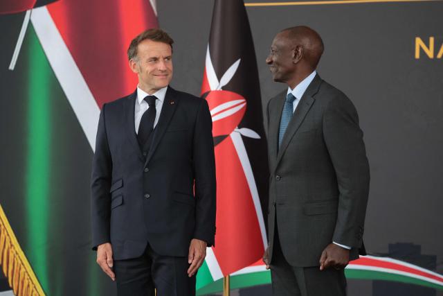 France's President Emmanuel Macron (L) looks at Kenya's President William Ruto (R) ahead of the Africa Forward: Africa- France Partnerships for Innovation and Growth Summit in Nairobi, on May 10, 2026. Kenya and France will jointly host the “Africa Forward: Africa- France Partnerships for Innovation and Growth” Summit, which will bring together African and French Heads of State and Government. (Photo by Ludovic MARIN / AFP)