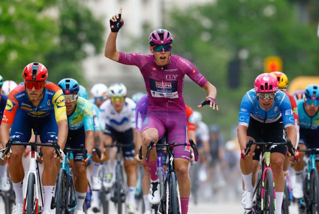 Soudal Quick-Step French rider Paul Magnier wearing the points classification mauve jersey (Maglia Ciclamino) celebrates as he crosses the finish line to win the 3nd stage of the Giro d'Italia 2026 - Tour of Italy cycling race between Plovdiv and Sofia, Bulgaria, on May 10, 2026. (Photo by Luca Bettini / AFP)