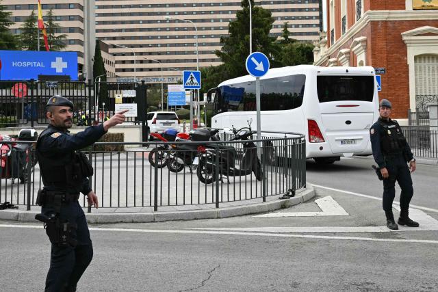 The convoy of Spanish passengers that were evacuated from the Dutch flagged hantavirus-stricken cruise ship MV Hondius arrives to the Gomez Ulla Defense Hospital in Madrid. on May 10, 2026. Repatriation flights for the nearly 150 passengers onboard the ship hit by a deadly hantavirus outbreak got underway as passengers and some crew members were transferred to shore on smaller vessels then by bus to the airport and then flown home after weeks at sea. (Photo by Javier SORIANO / AFP)