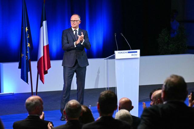 French right-wing party Horizons founder and president, mayor of Le Havre and candidate for the 2027 French presidential election Edouard Philippe applauds on stage at the end of his address at a party’s senior officials rally in Reims on May 10, 2026. (Photo by Martin BUREAU / AFP)