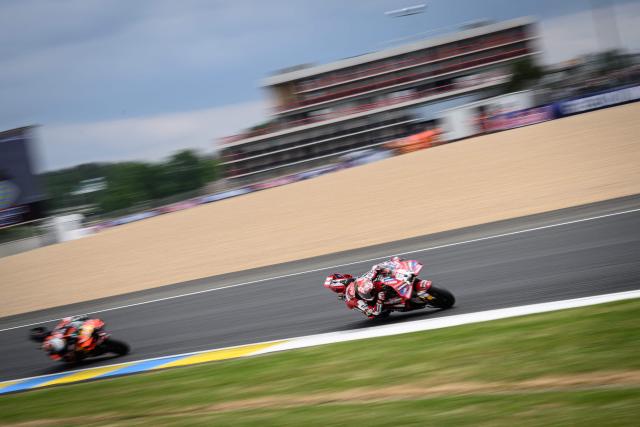 Ducati Lenovo Team's Italian rider Francesco Bagnaia (R) corners during the Moto GP Grand Prix of France at Le Mans, northwestern France, on May 10, 2026. (Photo by Loic VENANCE / AFP)