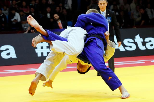 Kazakhstan's Aidar Arapov (white) and Netherlands' Frank De Wit compete in the men's under 90 kg bronze medal bout at the Astana Grand Slam judo tournament in Astana on May 10, 2026. (Photo by STANISLAV FILIPPOV / AFP)