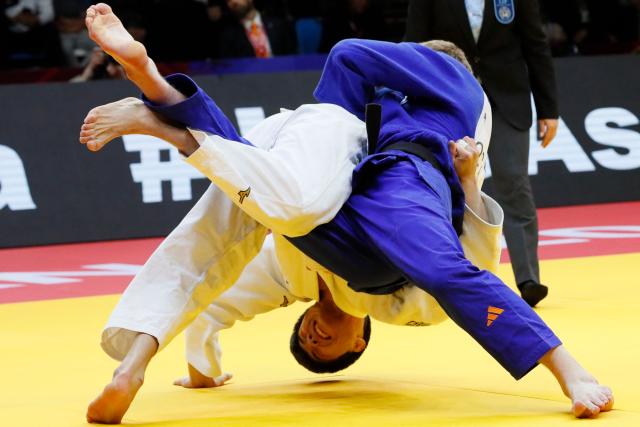 Kazakhstan's Aidar Arapov (white) and Netherlands' Frank De Wit compete in the men's under 90 kg bronze medal bout at the Astana Grand Slam judo tournament in Astana on May 10, 2026. (Photo by STANISLAV FILIPPOV / AFP)