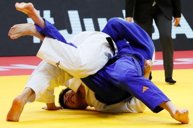 Kazakhstan's Aidar Arapov (white) and Netherlands' Frank De Wit compete in the men's under 90 kg bronze medal bout at the Astana Grand Slam judo tournament in Astana on May 10, 2026. (Photo by STANISLAV FILIPPOV / AFP)