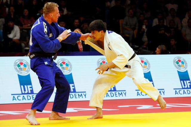Kazakhstan's Aidar Arapov (white) and Netherlands' Frank De Wit compete in the men's under 90 kg bronze medal bout at the Astana Grand Slam judo tournament in Astana on May 10, 2026. (Photo by STANISLAV FILIPPOV / AFP)