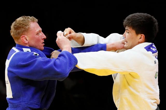Kazakhstan's Aidar Arapov (white) and Netherlands' Frank De Wit compete in the men's under 90 kg bronze medal bout at the Astana Grand Slam judo tournament in Astana on May 10, 2026. (Photo by STANISLAV FILIPPOV / AFP)