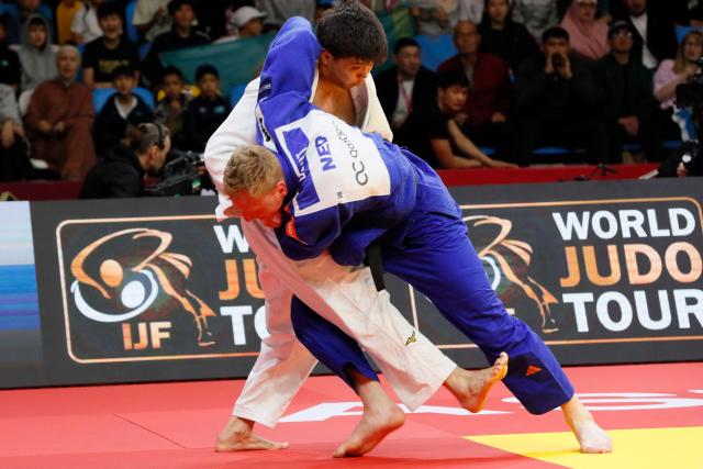 Kazakhstan's Aidar Arapov (white) and Netherlands' Frank De Wit compete in the men's under 90 kg bronze medal bout at the Astana Grand Slam judo tournament in Astana on May 10, 2026. (Photo by STANISLAV FILIPPOV / AFP)