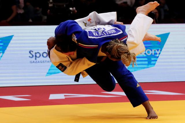 Kazakhstan's Ekaterina Tokareva (white) and France's Liz Ngelebeya compete in the women's under 78 kg bronze medal bout at the Astana Grand Slam judo tournament in Astana on May 10, 2026. (Photo by STANISLAV FILIPPOV / AFP)