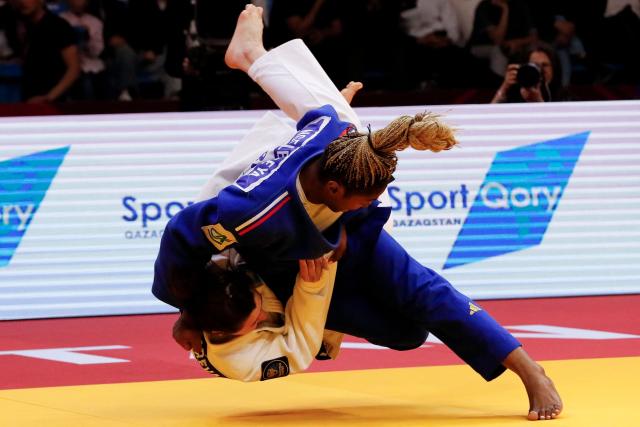 Kazakhstan's Ekaterina Tokareva (white) and France's Liz Ngelebeya compete in the women's under 78 kg bronze medal bout at the Astana Grand Slam judo tournament in Astana on May 10, 2026. (Photo by STANISLAV FILIPPOV / AFP)