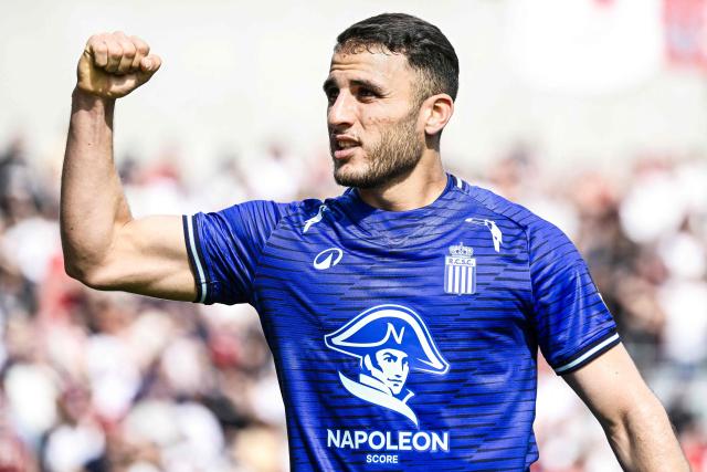 Charleroi SC's Algerian midfielder #22 Yacine Titraoui celebrates after scoring his team's first goal during the Belgian "Pro League" First Division play-off football match between Royal Antwerp FC and Charleroi SC at Bosuilstadion in Antwerp, northern Belgium on May 10, 2026. (Photo by Tom Goyvaerts / BELGA / AFP) / Belgium OUT