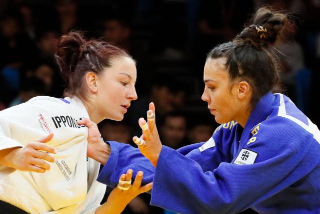 Germany's Anna Monta Olek (white) and Germany's Alina Boehm compete in the women's under 78 kg gold medal bout at the Astana Grand Slam judo tournament in Astana on May 10, 2026. (Photo by STANISLAV FILIPPOV / AFP)