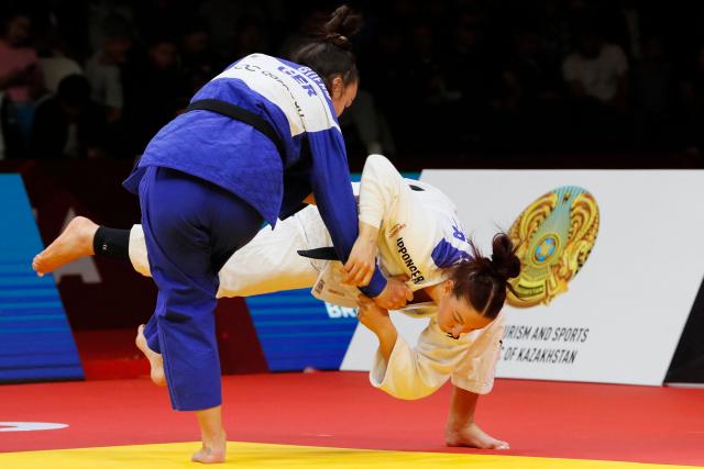 Germany's Anna Monta Olek (white) and Germany's Alina Boehm compete in the women's under 78 kg gold medal bout at the Astana Grand Slam judo tournament in Astana on May 10, 2026. (Photo by STANISLAV FILIPPOV / AFP)