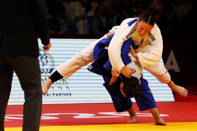 Germany's Anna Monta Olek (white) and Germany's Alina Boehm compete in the women's under 78 kg gold medal bout at the Astana Grand Slam judo tournament in Astana on May 10, 2026. (Photo by STANISLAV FILIPPOV / AFP)