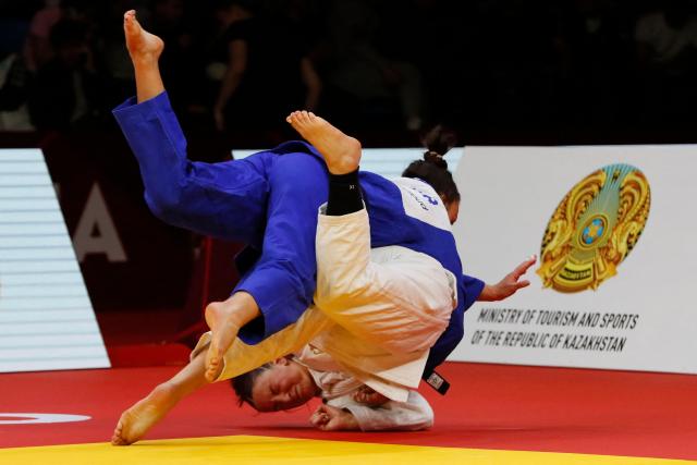 Germany's Anna Monta Olek (white) and Germany's Alina Boehm compete in the women's under 78 kg gold medal bout at the Astana Grand Slam judo tournament in Astana on May 10, 2026. (Photo by STANISLAV FILIPPOV / AFP)