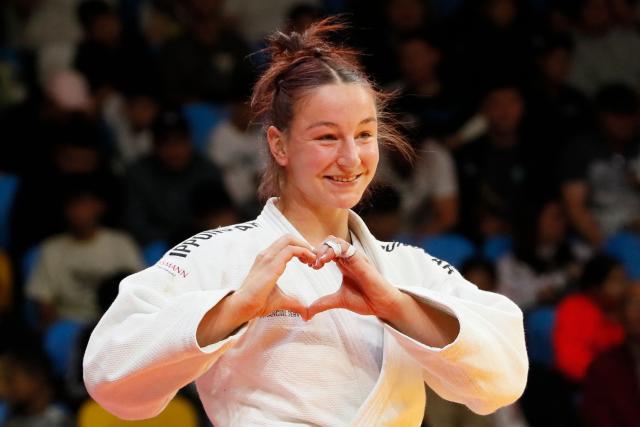 Germany's Anna Monta Olek (white) and Germany's Alina Boehm compete in the women's under 78 kg gold medal bout at the Astana Grand Slam judo tournament in Astana on May 10, 2026. (Photo by STANISLAV FILIPPOV / AFP)