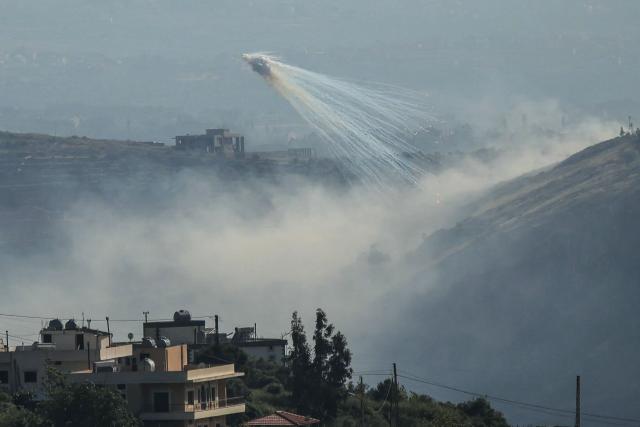 A photograph taken from the southern area of Marjayoun shows trails of smoke during Israeli shelling on the outskirts of the village of Yohmor on May 10, 2026. Lebanon's health ministry said two paramedics from the Hezbollah-affiliated Islamic Health Committee were killed and five others wounded on May 10 in Israeli strikes on the country's south despite a ceasefire. (Photo by AFP)