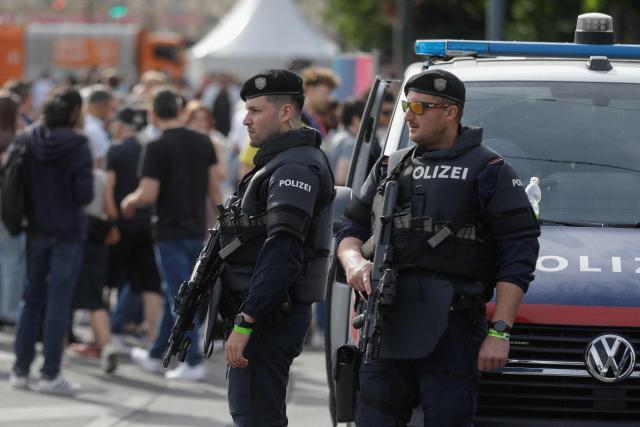 Armed Police patrol ahead of the opening ceremony of the Eurovision Song Contest 2026 at the City Hall Square in Vienna, Austria on May 10, 2026. The event is the official starting point of Eurovision week in Vienna. The city will host the two semi-finals on May 12 and May 14 and the final on May 16, 2026. (Photo by Alex HALADA / AFP)