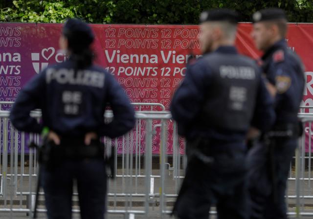 Police patrol ahead of the opening ceremony of the Eurovision Song Contest 2026 at the City Hall Square in Vienna, Austria on May 10, 2026. The event is the official starting point of Eurovision week in Vienna. The city will host the two semi-finals on May 12 and May 14 and the final on May 16, 2026. (Photo by Alex HALADA / AFP)