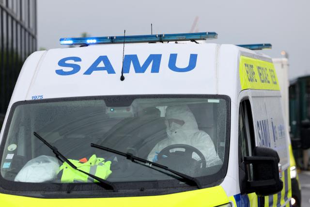 TOPSHOT - An ambulance transporting French national passengers of the MV Hondius, where an outbreak of hantavirus has been detected, leaves Le Bourget airport after plane repatriating them landed, in the outskirts of Paris on May 10, 2026. The evacuation of the approximately 150 passengers and crew members of the MV Hondius, where an outbreak of hantavirus has been detected, began on on May 10, 2026 with the Spanish and French nationals at a port on the island of Tenerife in the Canary Islands; the operation, which is being closely monitored, is set to continue until May 11. The World Health Organisation (WHO) has identified six confirmed cases of hantavirus out of eight suspected cases, including three people who have died from this known but rare virus, for which there is neither a vaccine nor a treatment. (Photo by Xavier GALIANA / AFP)