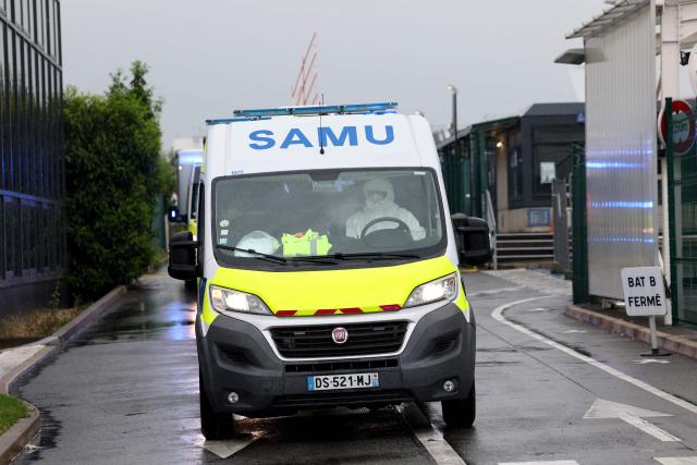An ambulance transporting French national passengers of the MV Hondius, where an outbreak of hantavirus has been detected, leaves Le Bourget airport after plane repatriating them landed, in the outskirts of Paris on May 10, 2026. The evacuation of the approximately 150 passengers and crew members of the MV Hondius, where an outbreak of hantavirus has been detected, began on on May 10, 2026 with the Spanish and French nationals at a port on the island of Tenerife in the Canary Islands; the operation, which is being closely monitored, is set to continue until May 11. The World Health Organisation (WHO) has identified six confirmed cases of hantavirus out of eight suspected cases, including three people who have died from this known but rare virus, for which there is neither a vaccine nor a treatment. (Photo by Xavier GALIANA / AFP)