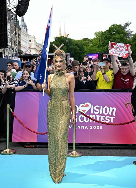 Australian singer Delta Goodrem, representing Australia with the song 'Eclipse', pose for photos on the turquoise carpet for the opening ceremony of the Eurovision Song Contest 2026 at the City Hall Square in Vienna, Austria on May 10, 2026. The event is the official starting point of Eurovision week in Vienna. The city will host the two semi-finals on May 12 and May 14 and the final on May 16, 2026. (Photo by Tobias SCHWARZ / AFP)