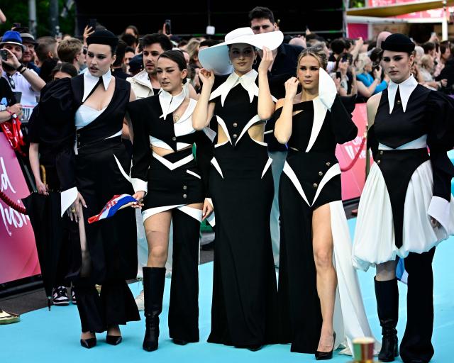 Croatian singers Inka Vecerina Perusic, Judita Storga, Korina Olivia Rogic, Lara Brtan and Marina Ramljak, of band Lelek and representing Croatia with the song 'Andromeda', pose for photographers on the turquoise carpet for the opening ceremony of the Eurovision Song Contest 2026 at the City Hall Square in Vienna, Austria on May 10, 2026. The event is the official starting point of Eurovision week in Vienna. The city will host the two semi-finals on May 12 and May 14 and the final on May 16, 2026. (Photo by Tobias SCHWARZ / AFP)