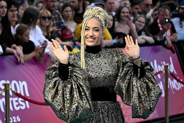 Monroe Vata Rigby, aka Monroe and representing France with the song 'Regarde !', pose for photographers on the turquoise carpet for the opening ceremony of the Eurovision Song Contest 2026 at the City Hall Square in Vienna, Austria on May 10, 2026. The event is the official starting point of Eurovision week in Vienna. The city will host the two semi-finals on May 12 and May 14 and the final on May 16, 2026. (Photo by Tobias SCHWARZ / AFP)
