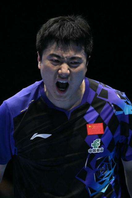China's Liang Jingkun reacts against Japan's Tomokazu Harimoto during their Men's Teams final match at the ITTF World Table Tennis Championships in Wembley Arena, west London on May 10, 2026. (Photo by Glyn KIRK / AFP)