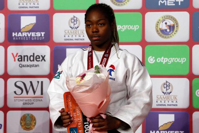 Bronze medallist France's Liz Ngelebeya celebrates on the podium for the women's under 78 kg event at the Astana Grand Slam judo tournament in Astana on May 10, 2026. (Photo by STANISLAV FILIPPOV / AFP)