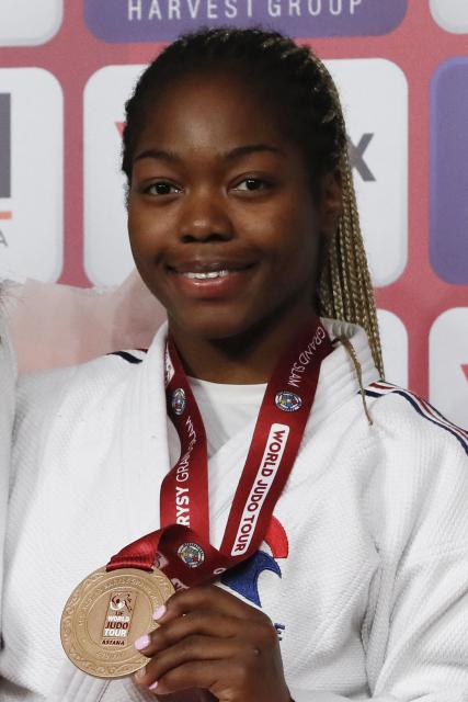 Bronze medallist France's Liz Ngelebeya celebrates on the podium for the women's under 78 kg event at the Astana Grand Slam judo tournament in Astana on May 10, 2026. (Photo by STANISLAV FILIPPOV / AFP)
